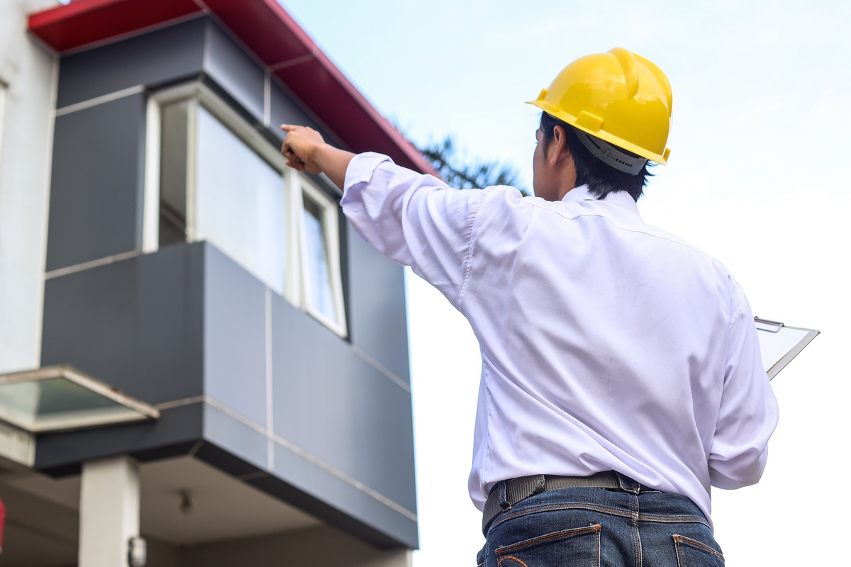 Inspector reviewing a home's exterior