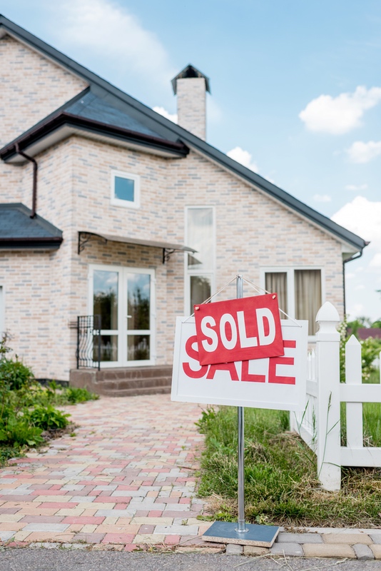 Sold home sign outside a residence
